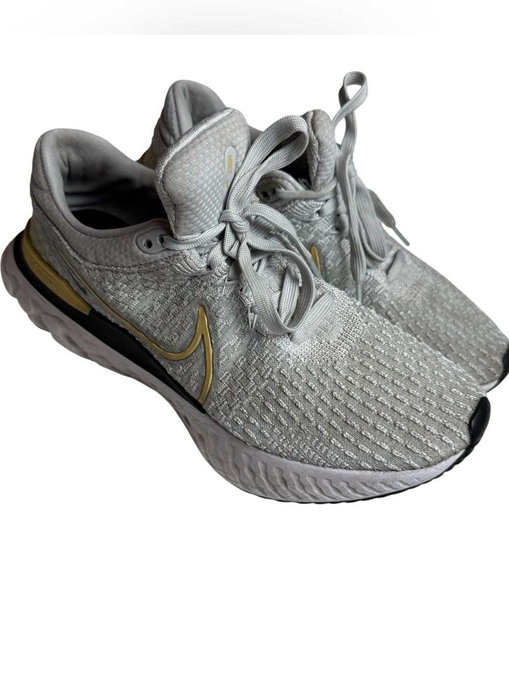 Nike Flyknit Women's Running Sneakers - Light Gray with Gold Accents